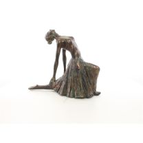 A RESIN FIGURINE OF A BALLERINA