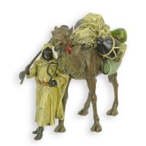 A BRONZE SCULPTURE OF A DROMEDARY WITH GUIDE