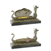 A BRONZE GROUP OF A PUTTO STEARING A GONDOLA