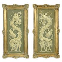 A PAIR OF FRAMED RESIN PLAQUES