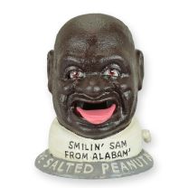 A CAST IRON SMILIN' SAM MECHANICAL BANK