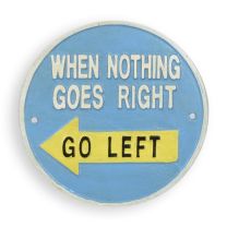 A CAST IRON "WHEN NOTHING GOES RIGHT, GO LEFT" PLAQUE