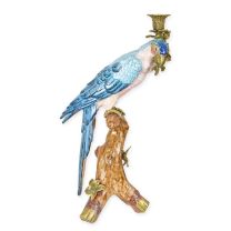 A BRONZE MOUNTED PORCELAIN PARROT CANDLEHOLDER