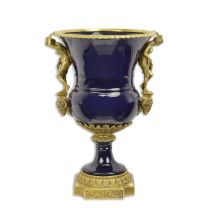 A BRONZE MOUNTED PORCELAIN URN
