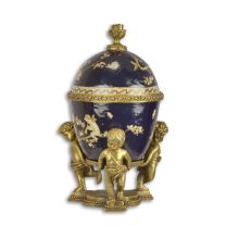 A BRONZE MOUNTED PORCELAIN EGG SHAPED BOX