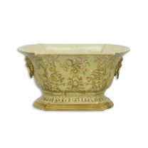 A BRONZE MOUNTED PORCELAIN PLANTER