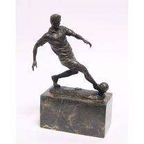 A BRONZE SCULPTURE OF A SOCCER PLAYER
