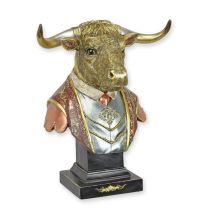 A RESIN FIGURINE OF AN OX