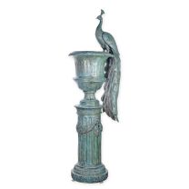 A LARGE BRONZE PEACOCK URN