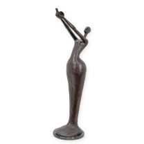 A MODERNIST BRONZE SCULPTURE OF A WOMAN HOLDIGN A BIRD