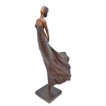 A MODERNIST BRONZE SCULPTURE OF A WOMAN IN DRESS