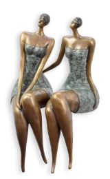 A BRONZE SCULPTURE OF TWO WOMAN SITTING MODEL