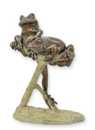 A BRONZE FOUNTAIN WITH TWO FROGS ON A BRANCH