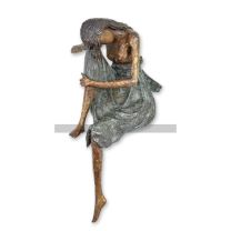 A BRONZE SCULPTURE OF A PENSIVE WOMAN