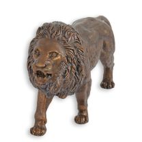 A BRONZE SCULPTURE OF A LION