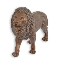 A BRONZE SCULPTURE OF A LION