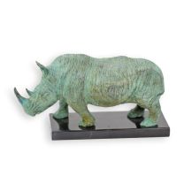 A BRONZE SCULPTURE OF A STANDING RHINO ON A MARBLE BASE