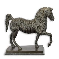 A BRONZE SCULPTURE OF A TROTTING HORSE