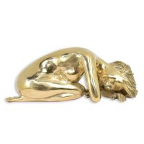 A BRONZE SCULPTURE OF A LYING FEMALE NUDE