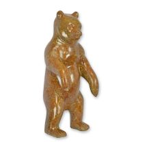 A BRONZE SCULPTURE OF A BROWN BEAR