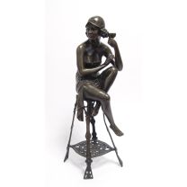 A BRONZE SCULPTURE OF THE CHAMPAGNE LADY