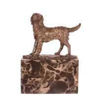 A BRONZE SCULPTURE OF A DOG
