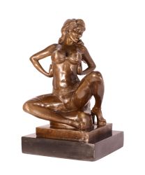 AN EROTIC BRONZE SCULPTURE OF SEMI NUDE FEMALE TAKING OFF HE