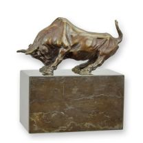 A BRONZE SCULPTURE OF A BULL