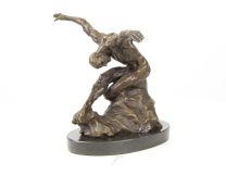 A MODERNIST BRONZE SCULPTURE OF A NUDE MALE DANCER
